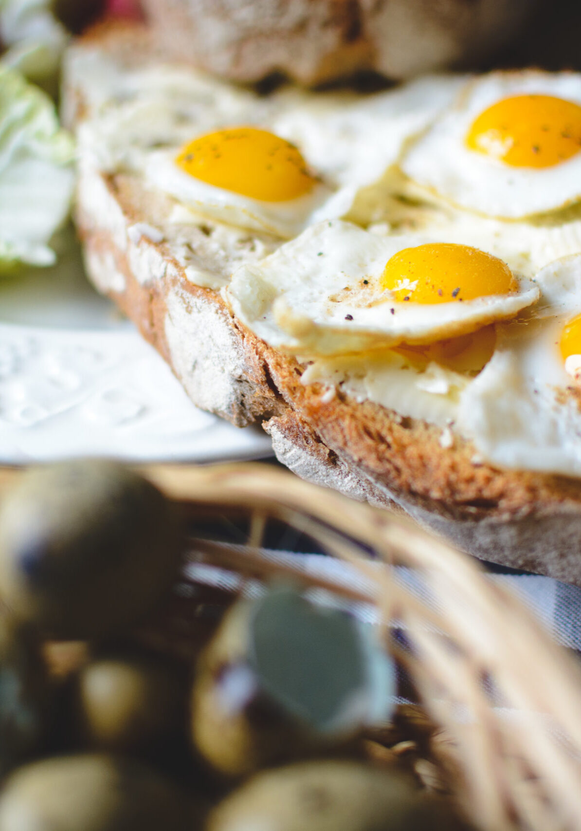 Quail eggs on bread with butter